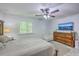 Comfortable bedroom with a wooden dresser, TV, ceiling fan, neutral paint, and carpet at 3230 Landing Pkwy, North Charleston, SC 29420