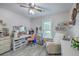 Bright bedroom featuring a work space, ceiling fan, window, and neutral colored walls at 3230 Landing Pkwy, North Charleston, SC 29420
