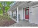 Inviting front porch with cozy seating and decorative details around the entrance at 3230 Landing Pkwy, North Charleston, SC 29420