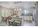 Bright open-concept kitchen with granite countertops, island seating, and an adjacent dining area at 3230 Landing Pkwy, North Charleston, SC 29420