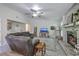 Bright living room with fireplace, ceiling fan and a large sectional sofa at 3230 Landing Pkwy, North Charleston, SC 29420