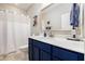 Charming bathroom features a stylish navy blue vanity, a white countertop, and modern fixtures at 3319 Dunwick Dr, Johns Island, SC 29455