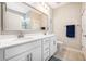 Bright bathroom featuring double sinks, a large mirror, and a combination shower and tub at 3319 Dunwick Dr, Johns Island, SC 29455
