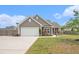 Attractive home with manicured lawn, paved driveway, and attached garage providing ample parking at 3319 Dunwick Dr, Johns Island, SC 29455