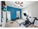 This home gym includes an exercise bike, workout bench with weights, and floor-to-ceiling mirror at 3319 Dunwick Dr, Johns Island, SC 29455