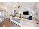 Bright living room featuring a ceiling fan and large sectional sofa at 3319 Dunwick Dr, Johns Island, SC 29455