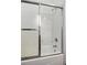 Bathroom features shower and tub with glass sliding door and chrome fixtures at 3320 Myrtle St, Edisto Island, SC 29438