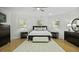 Beautiful bedroom features wood floors, ceiling fan, three windows, and furnishings at 3320 Myrtle St, Edisto Island, SC 29438