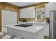 Bright kitchen boasts a marble island with modern white cabinets and stainless steel appliances at 3320 Myrtle St, Edisto Island, SC 29438