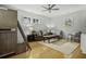 Living room features bunk beds, wood floors, comfortable furniture, and natural light at 3320 Myrtle St, Edisto Island, SC 29438