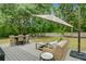 Back deck with patio dining set, lounge seating, backyard and mature trees at 3360 Fickling Hill Rd, Johns Island, SC 29455