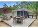 Back deck with patio dining set, lounge seating, screen porch, and backyard at 3360 Fickling Hill Rd, Johns Island, SC 29455