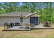 Backyard featuring a patio dining set, lounge seating, screen porch, and lush lawn at 3360 Fickling Hill Rd, Johns Island, SC 29455