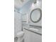 Bathroom featuring a granite countertop, round mirror, and shower with curtain at 3360 Fickling Hill Rd, Johns Island, SC 29455