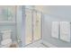 Bright bathroom featuring a glass shower, toilet, and towel rack at 3360 Fickling Hill Rd, Johns Island, SC 29455