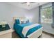 Cozy bedroom with a large window, light gray walls, and blue bedding at 3360 Fickling Hill Rd, Johns Island, SC 29455
