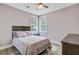 Bedroom with a ceiling fan, large window, and light purple walls at 3360 Fickling Hill Rd, Johns Island, SC 29455