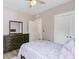 Bedroom with a ceiling fan, closet, and dark wood dresser at 3360 Fickling Hill Rd, Johns Island, SC 29455
