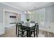 Dining room showcasing a large window and doorway to mud room at 3360 Fickling Hill Rd, Johns Island, SC 29455