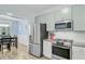 Charming kitchen with gray cabinets, stainless steel appliances, and granite countertops at 3360 Fickling Hill Rd, Johns Island, SC 29455