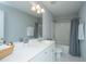 Clean bathroom with tiled shower, sink, and ample counter space at 3941 Bessemer Rd, Mount Pleasant, SC 29466