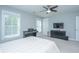 Comfortable bedroom with bed, piano, dresser, and ceiling fan; designed for rest and relaxation at 3941 Bessemer Rd, Mount Pleasant, SC 29466