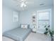 Simple bedroom featuring minimalist decor, natural lighting, and a small shelf at 3941 Bessemer Rd, Mount Pleasant, SC 29466