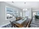 Dining room features a wooden table with seating for six and a bright window at 3941 Bessemer Rd, Mount Pleasant, SC 29466