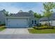 Inviting home with a two-car garage, well-maintained lawn, and attractive landscaping at 3941 Bessemer Rd, Mount Pleasant, SC 29466