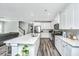 Bright, open-concept kitchen featuring a large island, stainless steel appliances, and white cabinets at 3941 Bessemer Rd, Mount Pleasant, SC 29466