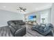 Comfortable living room with a plush sectional sofa, TV, and lots of natural light at 3941 Bessemer Rd, Mount Pleasant, SC 29466
