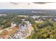 Aerial view of new construction homes surrounded by lush green trees and a Primary planned community at 401 Oak Hammock Ct # 48, Johns Island, SC 29455