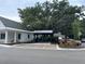 Community building with sidewalks, parking spaces, beautiful landscaping and an iconic live oak tree at 401 Oak Hammock Ct # 48, Johns Island, SC 29455