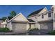 Modern home featuring a gray garage door, complemented by manicured landscaping for an inviting curb appeal at 401 Oak Hammock Ct # 48, Johns Island, SC 29455