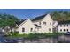 Charming two-story home with white siding, complemented by a neatly landscaped yard and a dark shingled roof at 401 Oak Hammock Ct # 48, Johns Island, SC 29455
