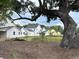 New construction homes featuring a farmhouse exterior style and beautiful live oak trees at 401 Oak Hammock Ct # 48, Johns Island, SC 29455