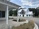 Beautiful exterior view of a home with a metal roof and modern design at 401 Oak Hammock Ct # 48, Johns Island, SC 29455