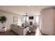 Inviting living room with a fireplace, ceiling fan, and large windows, offering a cozy and bright atmosphere at 401 Oak Hammock Ct # 48, Johns Island, SC 29455