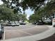 Picturesque parking area with neatly marked spaces, lush greenery, mature trees, and well-maintained landscaping at 401 Oak Hammock Ct # 48, Johns Island, SC 29455