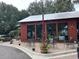Charming restaurant patio features string lights, outdoor seating, and lush greenery for a pleasant dining ambiance at 401 Oak Hammock Ct # 48, Johns Island, SC 29455