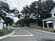 A peaceful street view showcasing modern homes, beautiful trees and manicured lawns at 401 Oak Hammock Ct # 48, Johns Island, SC 29455