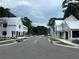 Beautiful street view showcases new homes with white exteriors and modern architectural details at 401 Oak Hammock Ct # 48, Johns Island, SC 29455