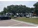 Street level view of community parking with buildings and beautiful landscaping at 401 Oak Hammock Ct # 48, Johns Island, SC 29455