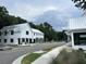 Scenic street with white buildings, gray skies, and new development at 401 Oak Hammock Ct # 48, Johns Island, SC 29455