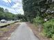 Scenic walking path lined with lush greenery, perfect for enjoying the neighborhood's natural beauty and promoting an active lifestyle at 401 Oak Hammock Ct # 48, Johns Island, SC 29455