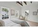 Bright bedroom with lots of natural light, exposed beams, and a comfortable bed featuring stylish decor and furnishings at 42 Poinsett St, Charleston, SC 29403