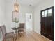 Elegant foyer featuring hardwood floors, a dark wood door, and stylish decor, creating an inviting entryway at 42 Poinsett St, Charleston, SC 29403