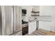 Modern kitchen featuring stainless steel appliances, white cabinets, and granite countertops at 42 Poinsett St, Charleston, SC 29403