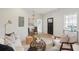 Open-concept living space with modern decor, dining area, and lots of natural light at 42 Poinsett St, Charleston, SC 29403