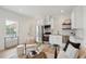 Bright living room featuring stainless steel appliances, white cabinetry, and an open-concept design at 42 Poinsett St, Charleston, SC 29403